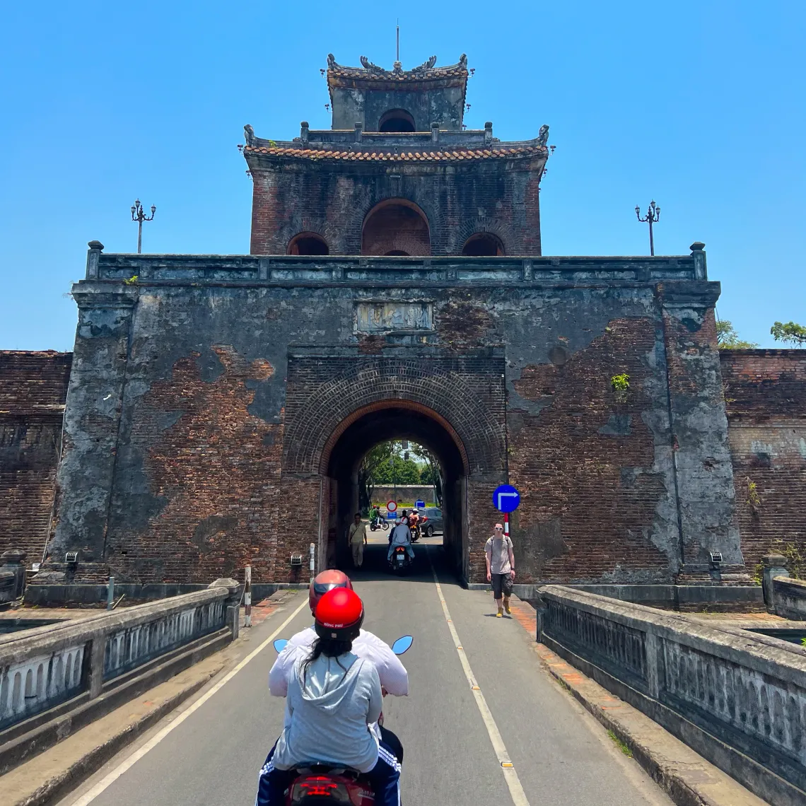 Image of entering the Hue Citadel on a moped. 